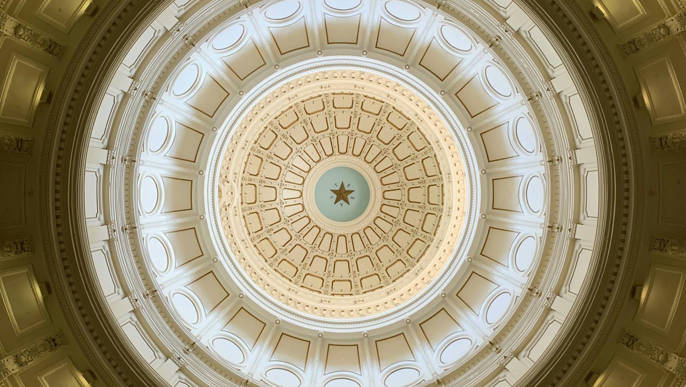 The dome of the Texas State Capitol in Austin seen from inside, with the star at its center.