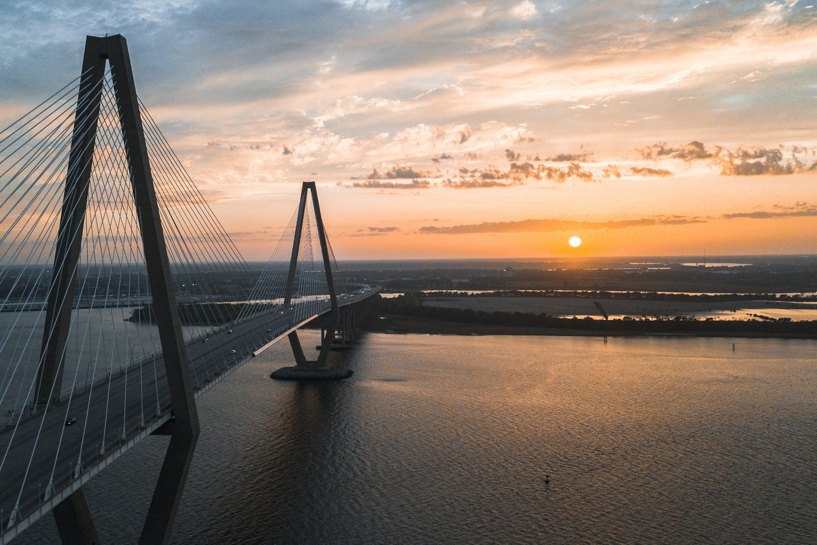 The Arthur Ravenel Jr. Bridge over the Cooper River at sunset in Charleston, South Carolina