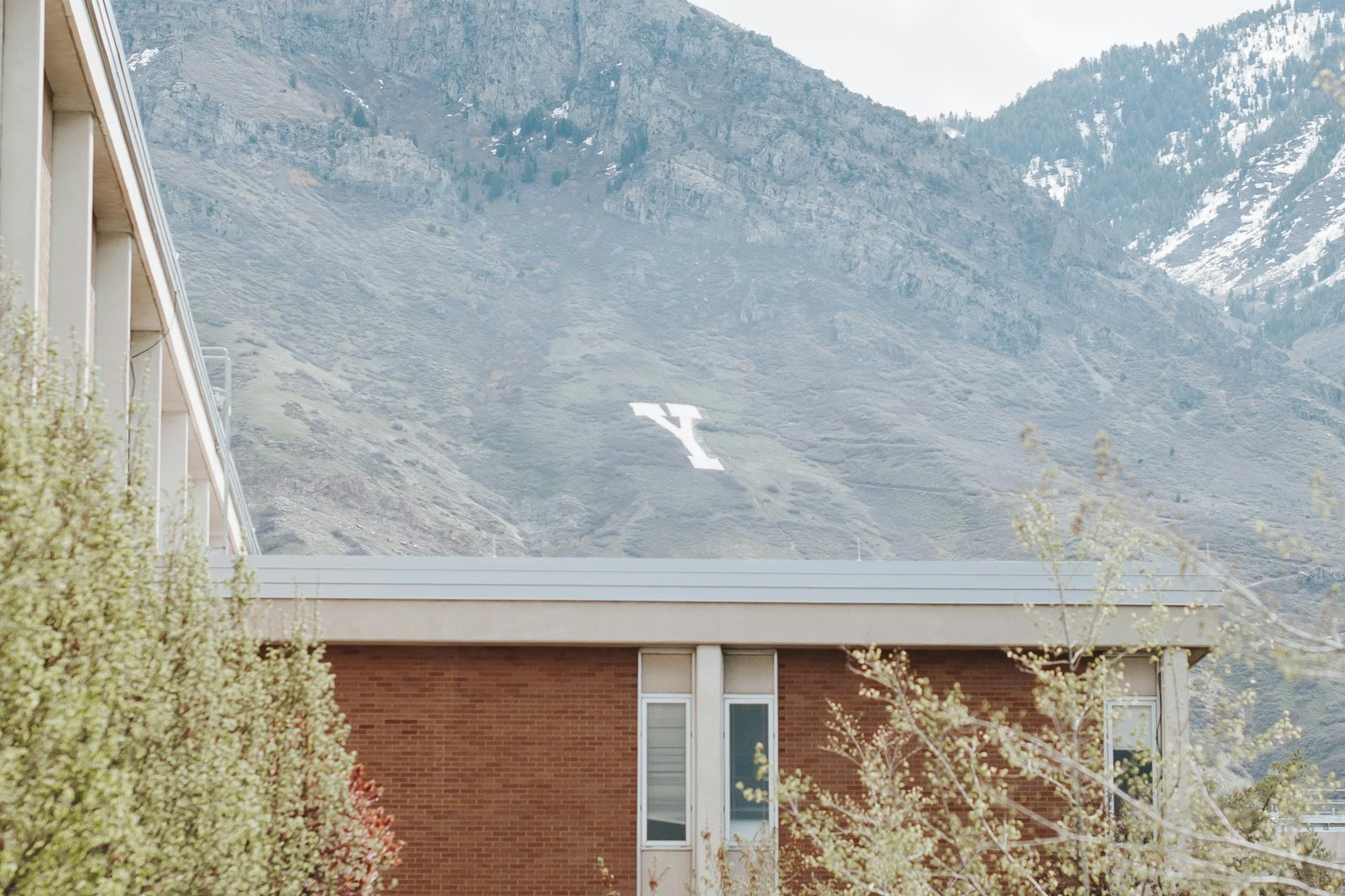 The Talmage Building on the Brigham Young University campus in Provo, with Y Mountain behind it
